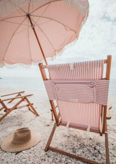Custom wooden beach lounge chair with pillow and patterned oxford cloth